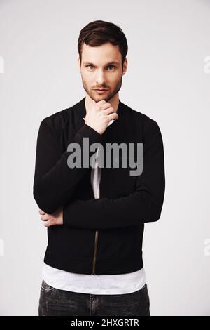 Contemplating his style. Portrait of a stylish and thoughtful looking young man. Stock Photo