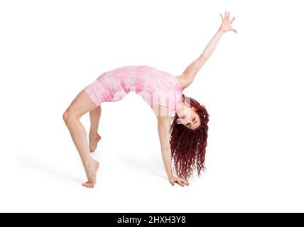 young woman dancer doing dance exercises on a white background Stock Photo