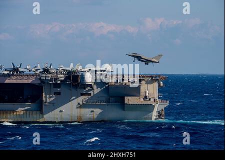 A French Rafale M aircraft prepares to land on USS Theodore Roosevelt ...