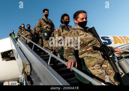 US Army soldiers with the 1st Armoured Brigade Combat Team, 3rd Infantry Division, arrive at Nuremberg International Airport on 28 February 2022 as part of the United States’ contribution to the NATO Response Force (NRF). The Fort Stewart, Georgia-based soldiers will be based in Grafenwöhr Training Area in the German state of Bavaria. The United States is sending thousands of troops to Europe to participate in the NRF, which was activated for the first time in history in a collective defence context.  (NATO Photo) Stock Photo