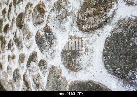 stone Wall pattern gray color of modern style design decorative uneven cracked real stone Wall surface with cement Stock Photo