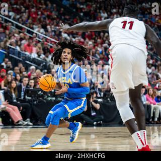 Las Vegas, NV, USA. 12th Mar, 2022. A. UCLA guard Tyger Campbell (10) goes to the basket in the first half during the NCAA Pac 12 Men's Basketball Tournament Championship game between UCLA Bruins and the Arizona Wildcats at T Mobile Arena Las Vegas, NV. Thurman James/CSM/Alamy Live News Stock Photo