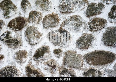 stone Wall pattern gray color of modern style design decorative uneven cracked real stone Wall surface with cement Stock Photo