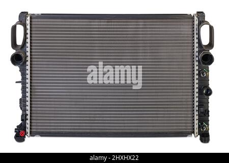 The aluminium radiator of engine on white, isolated background. Spare parts catalog. Stock Photo