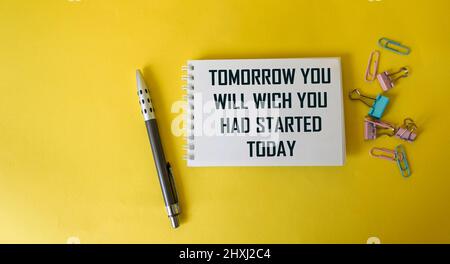 tomorrow you will be what you started today, motivation written on notepad and yellow background Stock Photo
