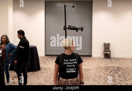 Texas, Texas, USA. 12th Mar, 2022. A woman is seen at the Innovation Awards Finalist Showcase, during the South by Southwest (SXSW) Conference and Festivals in Austin, Texas, the United States on March 12, 2022. South by Southwest (SXSW) Conference and Festivals, a conglomerate of film screenings, interactive media, music festivals and conferences, opened Friday in Austin, making the capital city of U.S. state of Texas an ocean of cross-industry discoveries and innovations. Credit: Nick Wagner/Xinhua/Alamy Live News Stock Photo