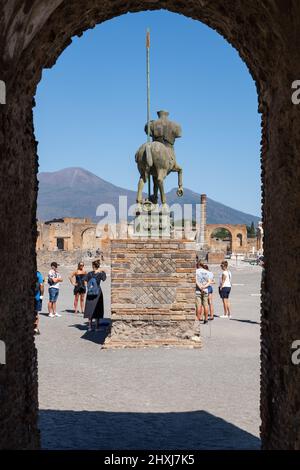 People at Pompeii Forum with statue of the Centaur in Campania, Italy. Stock Photo