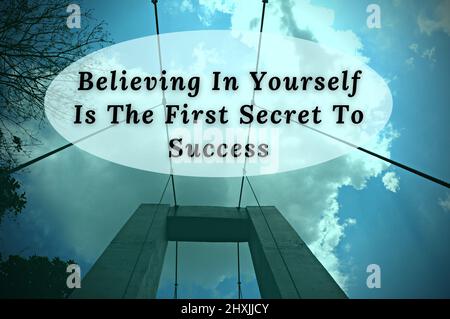 Motivational quote - Believing in yourself is the first secret to success. Blue sky and bridge background. Motivational concept Stock Photo