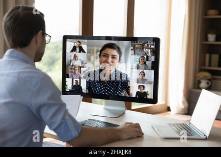 Young man look at computer screen study in conference app Stock Photo