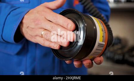 Checking gas masks. Clip. Testing of new gas masks in the workflow at factories Stock Photo