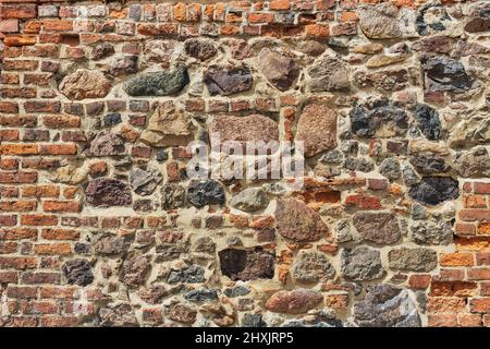 Details of a wall of bricks and rubble stones Stock Photo