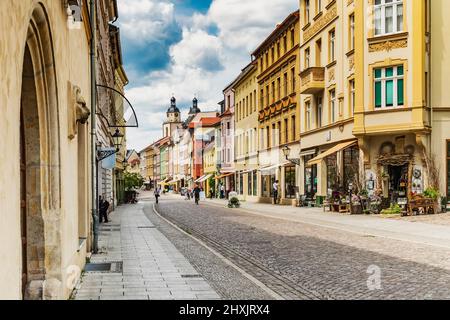 View through Collegienstrasse to the Wittenberg market square and the towers of the St. Mary's Church, Lutherstadt Wittenberg, Saxony-Anhalt, Germany Stock Photo