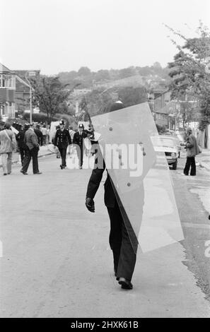 Battle of Lewisham, South London, Saturday 13th August 1977. National Front rally from New Cross to Lewisham is disrupted by counter demonstrations and leads to violent clashes with Police Officers and anti racism demonstrators. Pictured, Police Officers use riot shields for the first time on UK streets. Stock Photo