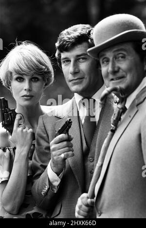 The Avengers will be coming back to the TV screen shortly, with a new leading lady in the form of lovely Joanna Lumley. Another new face will be that of Gareth Hunt, who will co-star with Joanna. Star of the series will be - as usual - Patrick Macnee who plays the stalwart John Steed. The trio are pictured ahead of the new series. 12th July 1976. Stock Photo