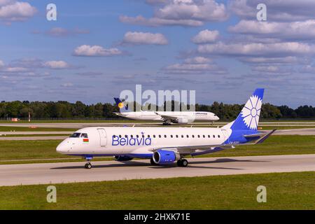 Munich, Germany - September 19. 2019 : Belavia Embraer E175LR with the aircraft registration EW-512PO  is taxiing for take off on the northern runway Stock Photo