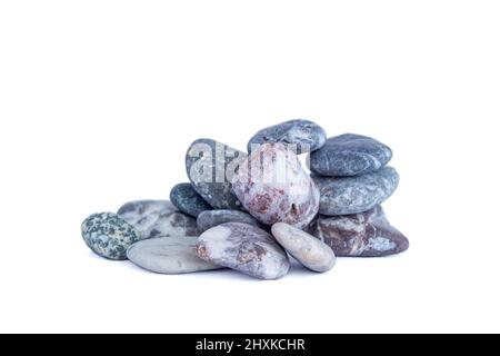Stack of pebble stones. Pebble stones isolated on white background. Stock Photo