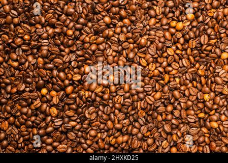 Coffee beans on a white background. Top view. Coffee beans texture. Stock Photo
