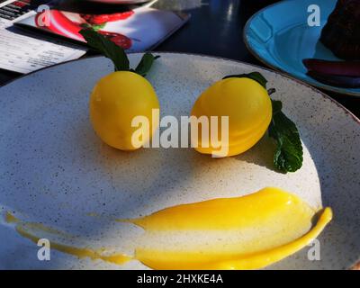 Dessert in the form of two lemons  Stock Photo