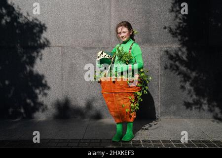 ***PARENTAL PERMISSION GIVEN**** Sophia-Mae Dowling (11), from Gorey, dressed in her home made costume as 'Audrey II' from the movie 'Little Shop of Horrors' attends Comic Con at the Convention Center, Dublin. Picture date: Sunday March 13, 2022. Stock Photo