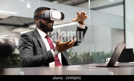 Black businessman testing new technologies for business Stock Photo