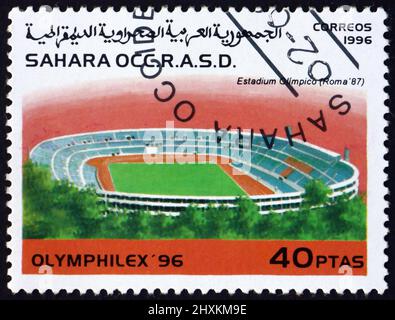 SAHARA - CIRCA 1996: a stamp printed in Sahrawi Arab Democratic Republic shows Olympic stadium, Rome, circa 1996 Stock Photo