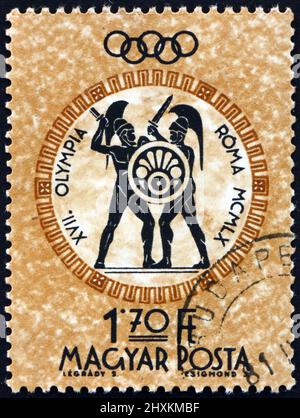 HUNGARY - CIRCA 1960: a stamp printed in Hungary shows swordsmen, 1960 Summer Olympics, Rome, circa 1960 Stock Photo