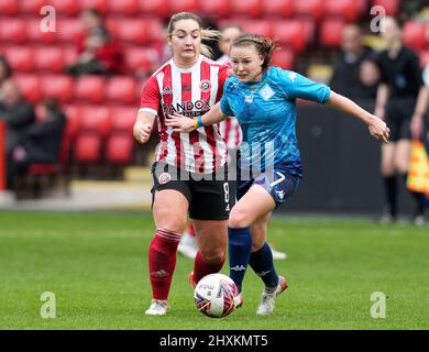 Sheffield, UK. 13th Mar, 2022. Maddy Cusack of Sheffield Utd tackles Alli Palisch of London City Lionesses during the The FA Women's Championship match at the Bramall Lane, Sheffield. Picture credit should read: Andrew Yates/Sportimage Credit: Sportimage/Alamy Live News Stock Photo