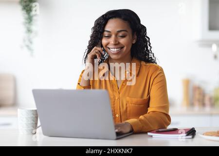 Pretty black woman freelancer working from home Stock Photo