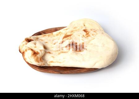 naan indian bread on plate isolated on white background Stock Photo