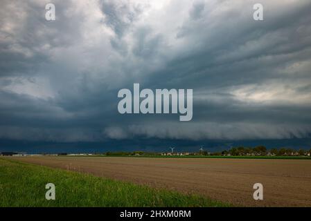 Severe thunderstorm with roll cloud over the fields of Holland Stock Photo