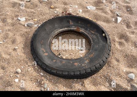 Car tire pollution at coastal. Environmental pollution Stock Photo - Alamy