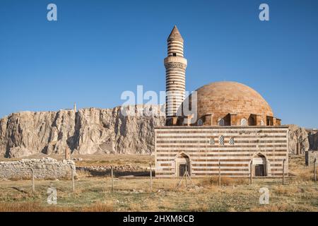 Kaya Celebi Cami mosque with Van Castle at background in Van city, Turkey Stock Photo