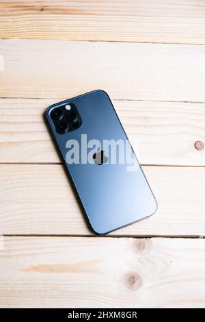 Badajoz, 03, 13, 2022. Iphone 13 on a wooden table Stock Photo