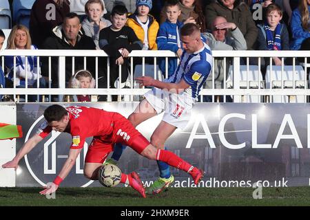 HARTLEPOOL, UK. MAR 12TH Hartlepool United's Marcus Carver battles for possession with Orient's Connor Wood during the Sky Bet League 2 match between Hartlepool United and Leyton Orient at Victoria Park, Hartlepool on Saturday 12th March 2022. (Credit: Mark Fletcher | MI News) Credit: MI News & Sport /Alamy Live News Stock Photo