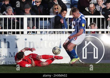 HARTLEPOOL, UK. MAR 12TH Hartlepool United's Marcus Carver battles for possession with Orient's Connor Wood during the Sky Bet League 2 match between Hartlepool United and Leyton Orient at Victoria Park, Hartlepool on Saturday 12th March 2022. (Credit: Mark Fletcher | MI News) Credit: MI News & Sport /Alamy Live News Stock Photo