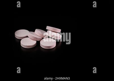 Selective focus on multivitamins effervescent tablets isolated on black. Bucharest, Romania, 2021 Stock Photo