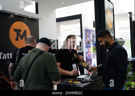 DUBAI, UAE, 13th March 2022. Exhibitors interact with visitors at the Dubai WOW (World of Web3) Summit. This event is a leading gathering of senior decision-makers discussing the impact of blockchain and associated technologies on financial services Stock Photo