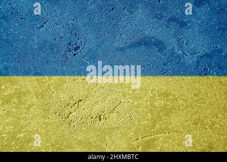 Ukraine national flag graffiti on detailed plastering wall. Yellow and light blue colors of Ukraine national flag. Stock Photo