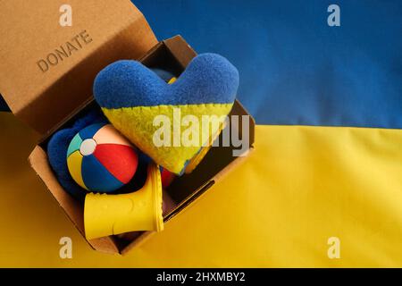 Donation concept. Heart and Ukrainian National colors with text