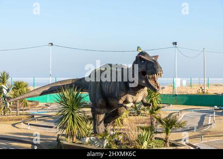 A dinosaur attrraction at the Jurassic Gardens attraction in Great Yarmouth in North Norfolk, UK on a sunny clear sky day Stock Photo