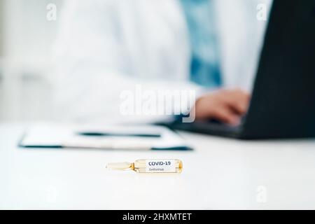 The hunt is on to save humanity. Cropped shot of a scientist using a laptop while working on a coronavirus cure in a laboratory. Stock Photo