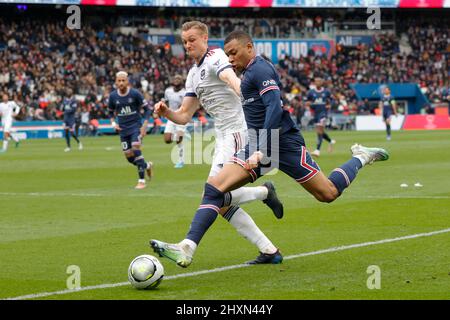 Paris, France. 13th Mar, 2022. Paris Saint-Germain's Kylian Mbappe (R) in action during a French Ligue 1 football match between Paris Saint-Germain (PSG) and Bordeaux in Paris, France, March 13, 2022. Credit: Rit Heize/Xinhua/Alamy Live News Stock Photo