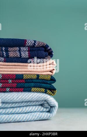 Stack of woolen checked blankets Stock Photo