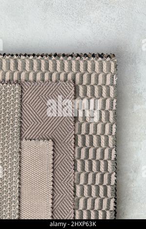 The background consists of several types of colored tiles with different patterns on beige tone. Stock Photo