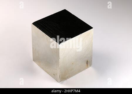 Cubic crystal of pyrite. Pyrite is an iron sulfide and the most abundant sulfide mineral. Stock Photo