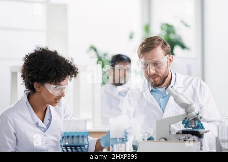 scientists examining control samples in the laboratory . Stock Photo