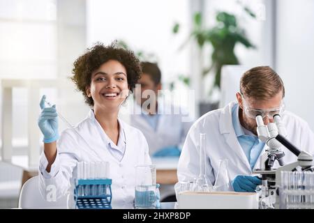 staff of the scientific laboratory is working on the creation of new drugs . Stock Photo