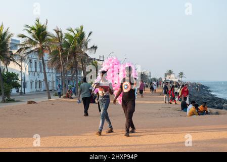 Pondicherry, India - 12 March 2022: Cotton candy's sellers on the promenade by the sea. Stock Photo