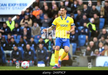 Lewis Dunk of Brighton during the Premier League match between Brighton and Hove Albion and Liverpool at the American Express Stadium  , Brighton , UK The Brighton team wore Ukrainian colours in support of the Ukraine in the war with Russia - 12th March 2022 Photo Simon Dack/Telephoto Images  Editorial use only. No merchandising. For Football images FA and Premier League restrictions apply inc. no internet/mobile usage without FAPL license - for details contact Football Dataco