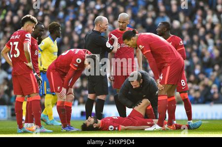 Mohammed Salah of Liverpool receives treatment during the Premier League match between Brighton and Hove Albion and Liverpool at the American Express Stadium  , Brighton , UK - 12th March 2022 Photo Simon Dack / Telephoto Images. Editorial use only. No merchandising. For Football images FA and Premier League restrictions apply inc. no internet/mobile usage without FAPL license - for details contact Football Dataco Stock Photo